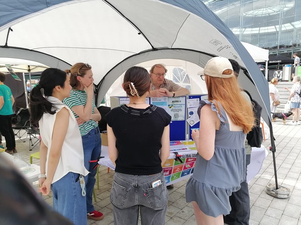 maNGOma attending a Reimagine Norwich event and discussing local and global issues with attendees